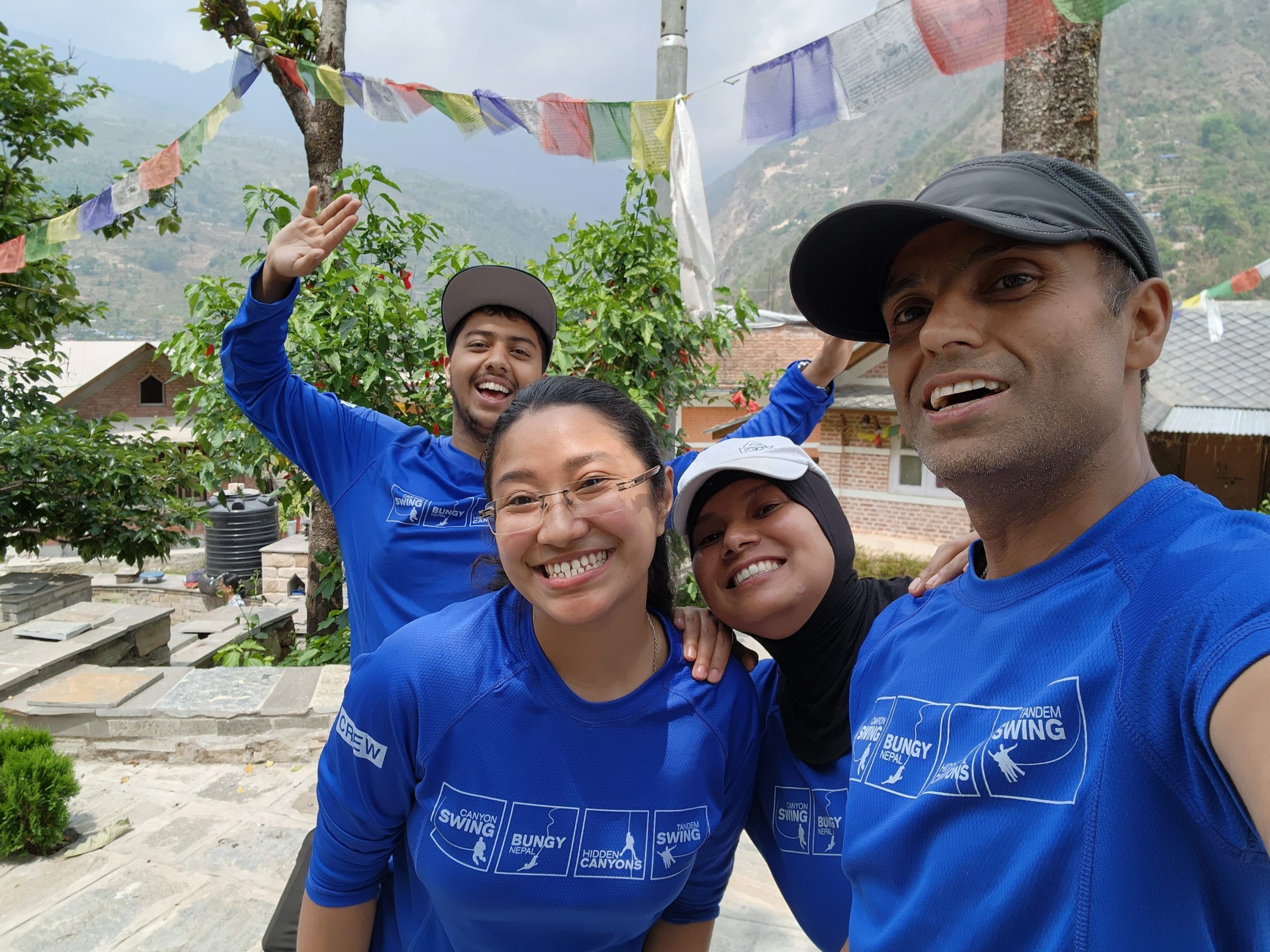 4 coach me nepal team members posing for selfie together